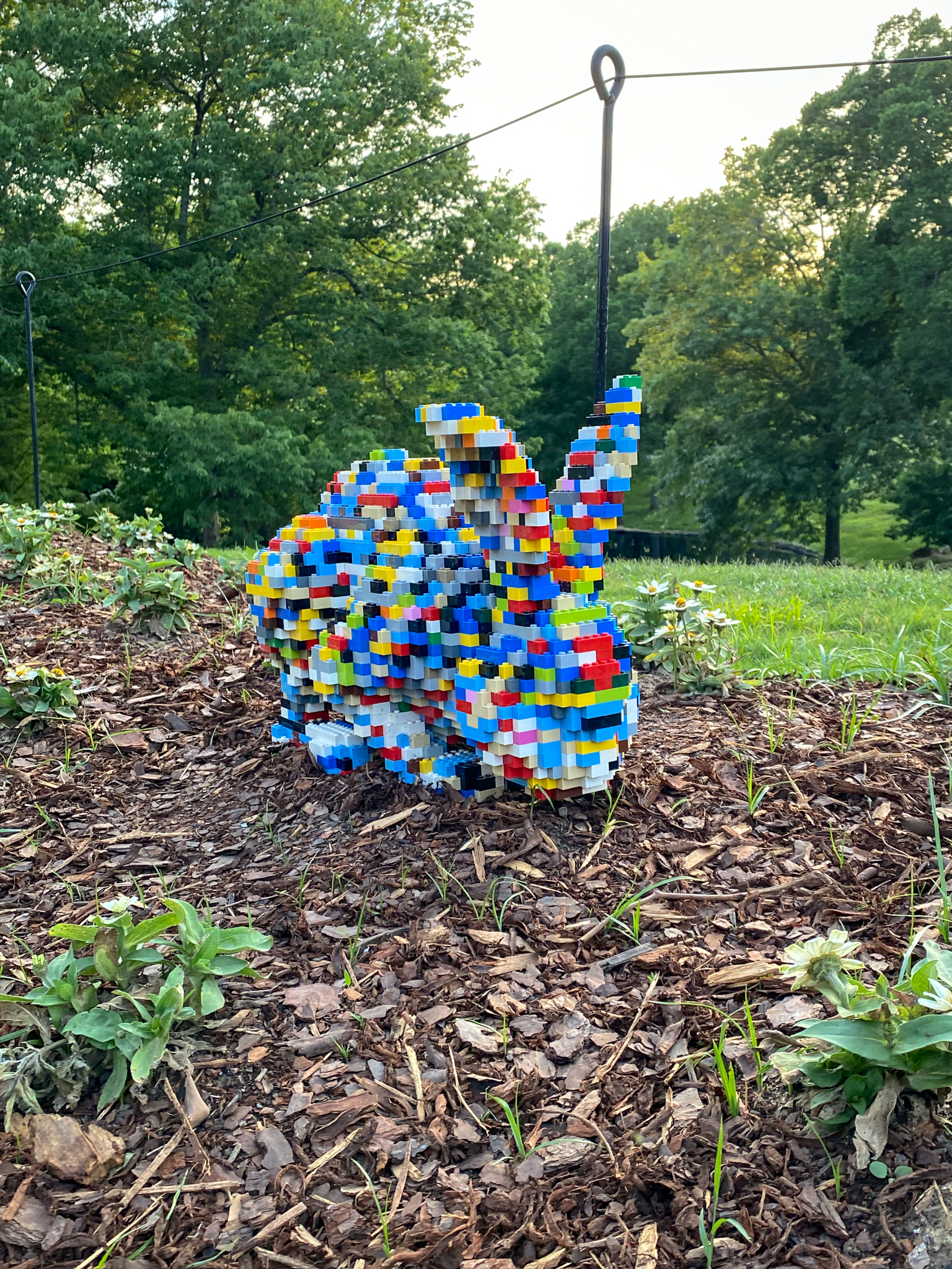 Multicolored Lego rabbit crouched down